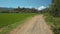 Ground Country Road Past Trees Field Distant Village