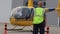 Ground crew member prepare a helicopter for departure