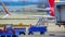 Ground Crew pull a ladder and loading equipment up to a Passenger jet