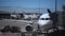 Ground crew working on unloading an airplane