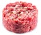 Ground cutlet or raw hamburger with seasonings on white background. Close-up