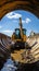 Ground excavation: Powerful caterpillar excavator works on construction site, by large concrete pipe.