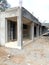 Ground floor of ultra modern four classroom building at frontal view with cloudy sky