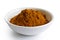 Ground ground masala spice mix in white ceramic bowl isolated on