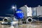 Ground handling of airplane near a passenger ramp at night