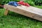 ground level side view of cornhole game board with bags on top i