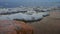 Ground Level Slider Truck Shot of Melting Spring Ice Along the Shore of Georgian Bay at Twilight