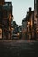 Ground-level vertical shot of a narrow paved street in Saint Jean De Luz in the early morning