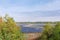 Ground-mounted solar power station among forest in autumn