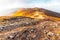 Ground rocky road stretches on ridge in highland in autumn