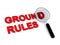 Ground rules with magnifying glass on white