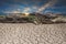 Ground soil desert broken drought stone, landscape cloud and blu