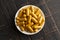 Ground Turmeric Capsules form on a Wooden Table