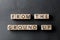 From the ground up - phrase from wooden blocks with letters