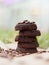 Ground used pressed coffee in washers, stack of five pieces close-up