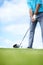 Grounding the club. Cropped image of a young male golfer teeing up to play a shot with his driver.