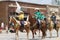 Group of 4H riders on horseback in a parade in small town America