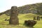 Group of abandoned massive Moai statues scattered on the slope of Rano Raraku volcano, historic Moai quarry on Easter Island