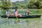 Group adventurous explorer friends are canoeing in a wild river