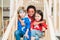 Group of affectionate little friends of various ethnicities sitting on staircase