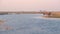 Group of African Elephants drinking water from Chobe River at sunset. Wildlife Safari and boat cruise in the Chobe National Park,