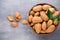 Group of almond nuts with leaves.Wooden background.