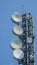 Group of antennas, satellite dishes for telecommunications, television broadcast, cellphone on mountain peak