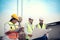 Group of architects, construction foremen, and construction engineers review the work and talk about how the project