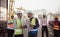 Group of architects, construction foremen, and construction engineers review the work and talk about how the project,