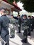 A group of army soldiers back view stand in line at a funeral service in Nakhon Sawan, Thailand, 19 Feb 2022.