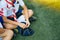 Group of Asian boy scout sitting on greensward for relax time. A