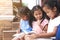 Group of asian children reading a book