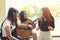 Group of asian teenager happiness emotion playing spanish guitar on location