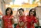 Group of asian woman wearing chinese tradition clothes toothy smiling face happiness emotion and hand sign i love you