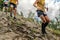 group athletes runners running down steep mountainside