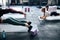 Group of athletic ladies doing planks on gym floor