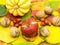 Group of autumn fruits on colored autumnal leafs carpet seasonal concept