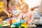 Group of babies with mothers at playgroup