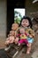 Group of baby dolls sitting on old wooden stairs