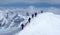 Group of backcountry skiers on a ski mountaineering tour in the Austrian Alps heading to the summit of Grossvenediger