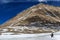 Group of backpacker are walking on the frozen river on the way to sacred Kailash mountain,Tibet