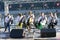 Group of bandurists playing ethno music on the beach, Dnipro river on a background. Bandura is an Ukrainian national musical