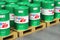 Group of barrels with motor oil lubricant on shipping pallets in