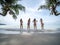 Group of beautiful asian women in bikini posting on tropical sea beach with palm tree. pregnant female traveling with friends for