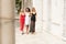 Group of beautiful ladies in elegant dresses at sunny summe