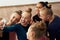 Group of beautiful little girls, children, rhythmic gymnasts doing selfie with phone after training session indoors