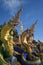 Group of beautiful statues of Buddha images, angels and Nagas at Wat Don Khanak Temple.