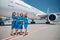 Group of beautiful stewardesses standing outdoors in airfield