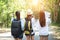 Group of beautiful young women walking in the forest,