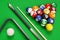 Group of billiard colored balls, cues and triangle